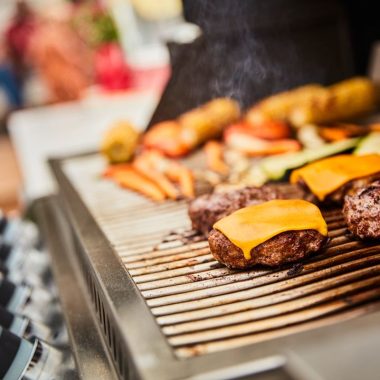 Burgers and Cheeseburgers on an outdoor grill
